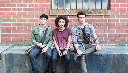 Teenagers sitting on a wall