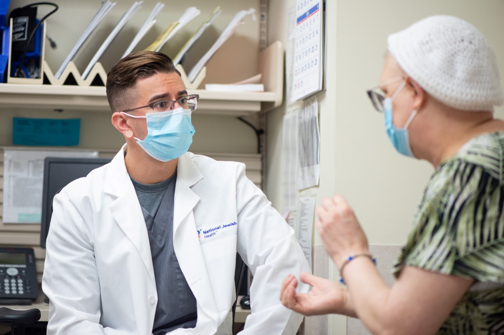 National Jewish Health cardio-oncologist Christopher Fine, MD, FACC with a patient