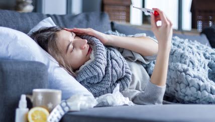 sick woman on couch