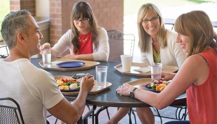 group of people enjoying lunch