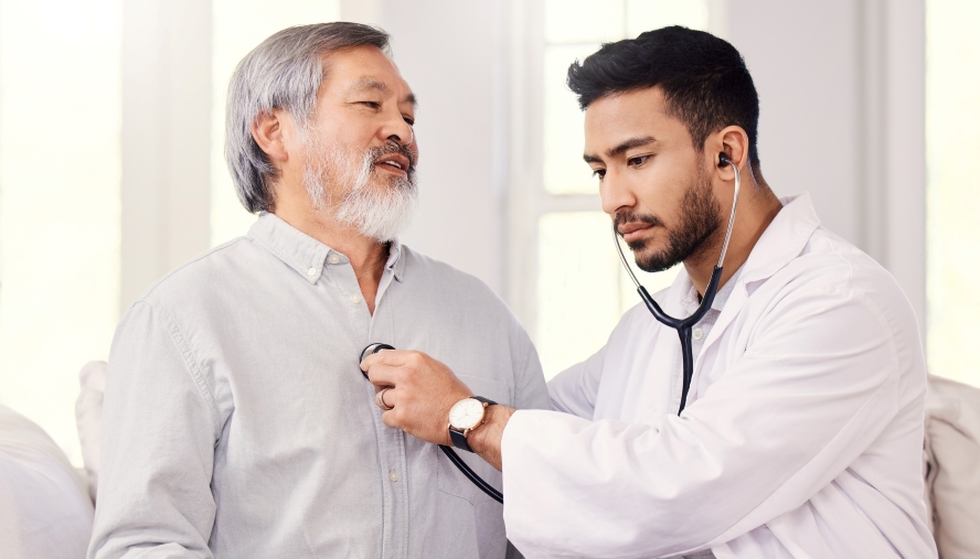 Physician taking patient heart beat