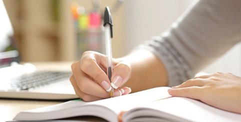 woman writing a list