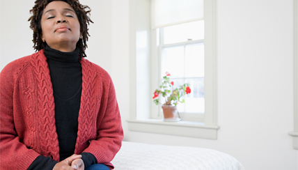 Woman relaxing by window