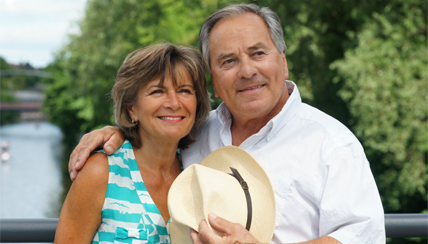 husband and wife smiling