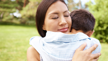 woman hugging her child