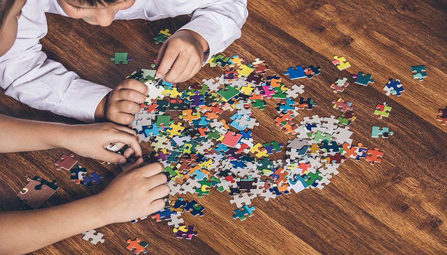 Children playing with a puzzle