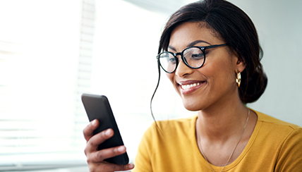 woman looking at mobile phone