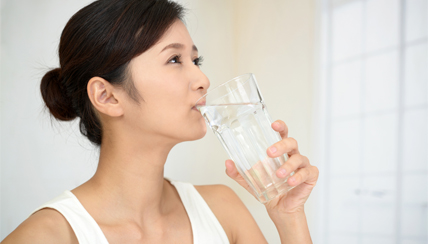 Woman drinking a glass of water