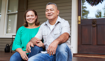 Couple sitting together on front porch