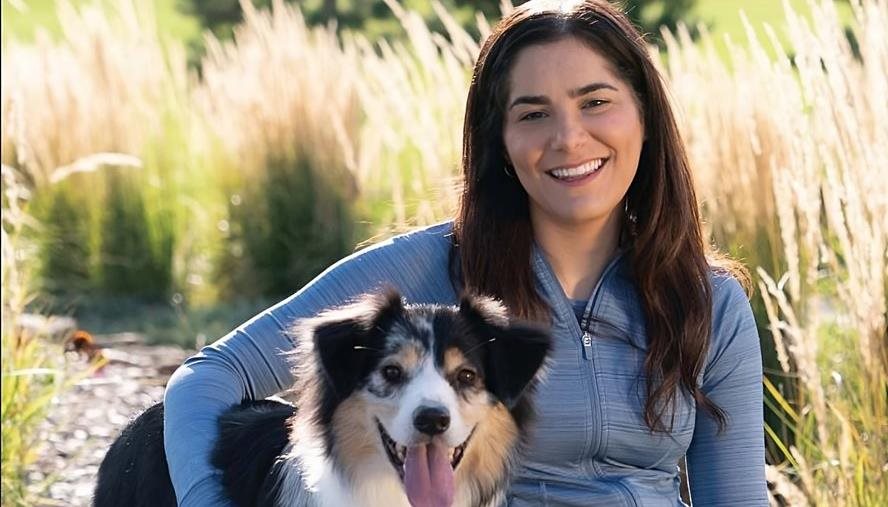 Sophia and her dog in a field