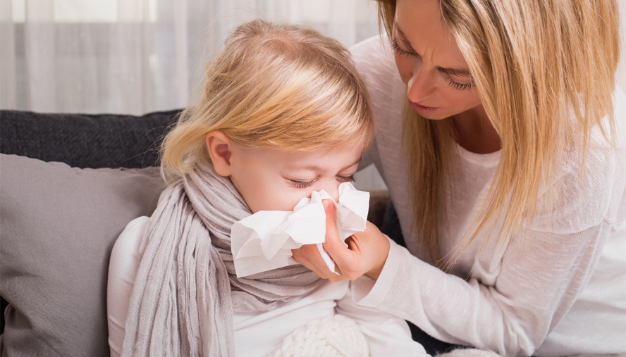 Child blowing her nose