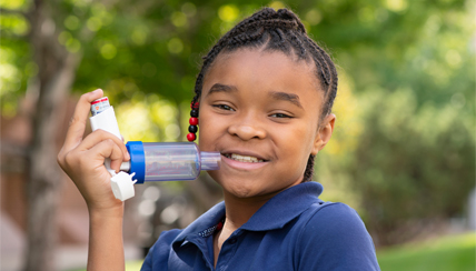 child with an asthma device