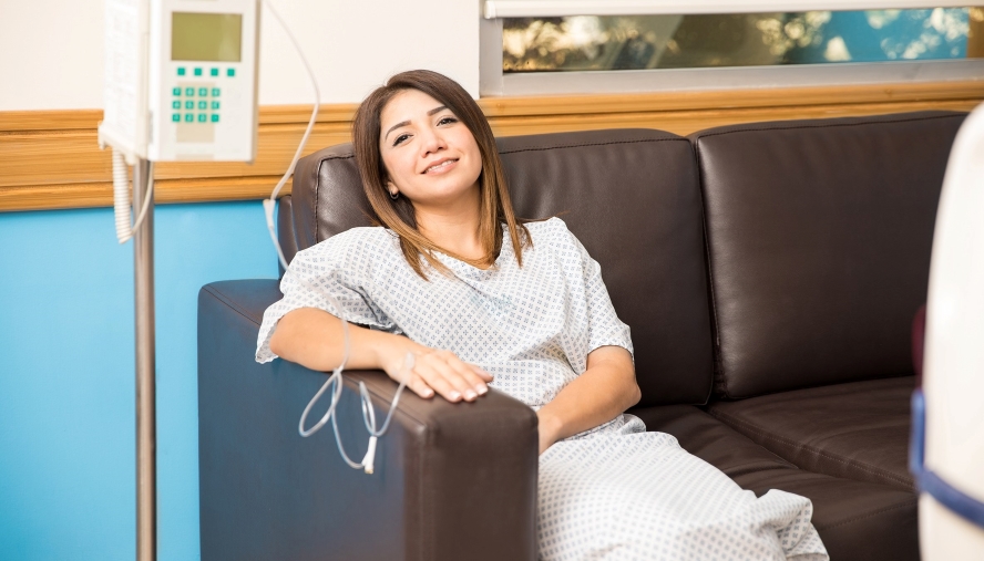 Patient smiling attached to monitor