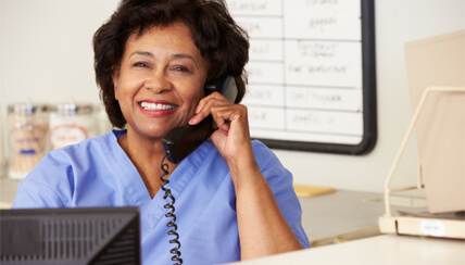 Nurse speaking with patient via phone