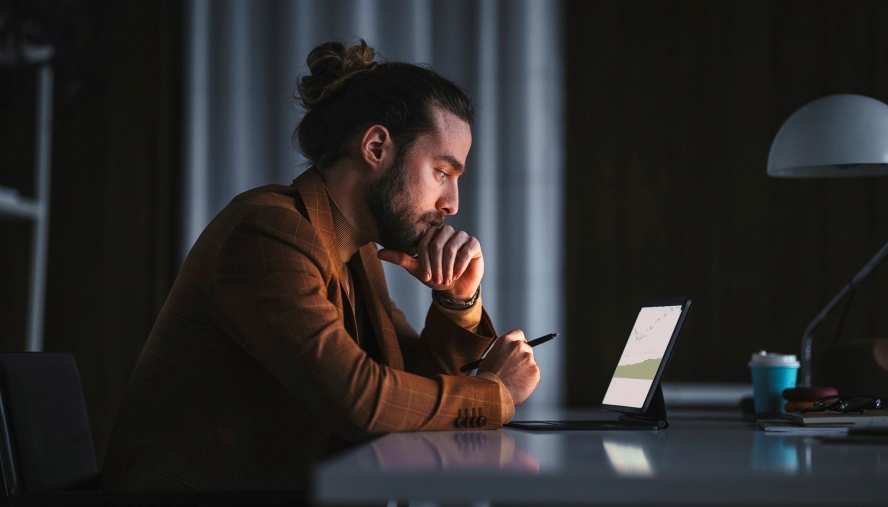 man studying info on a tablet