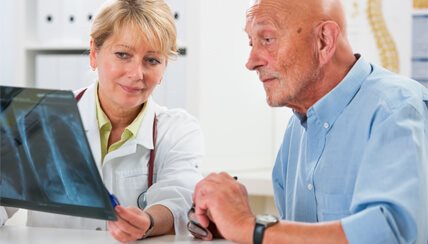 Physician teaching patient about Chronic Beryllium Disease