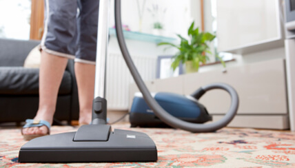 person vacuuming