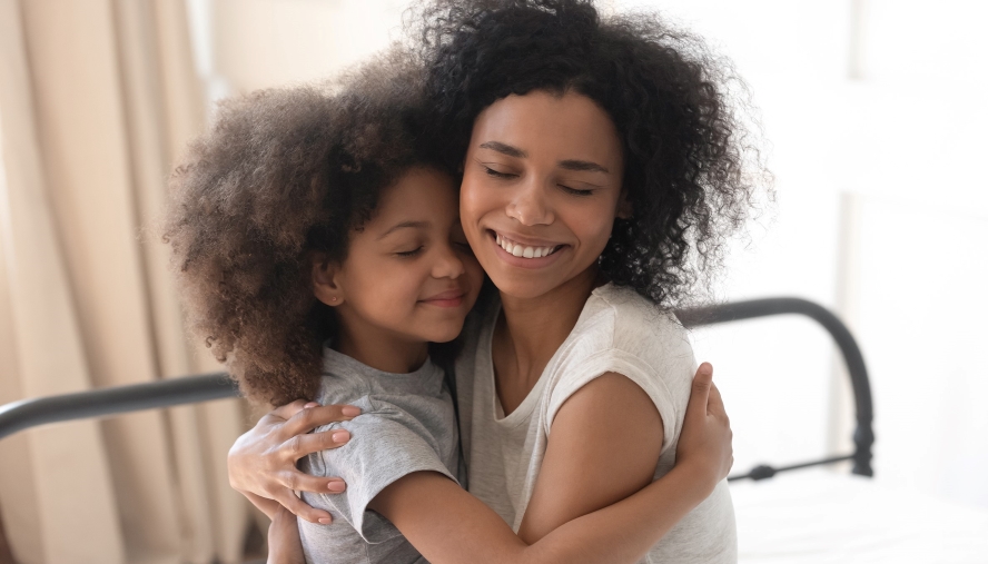 Mother and daughter embracing