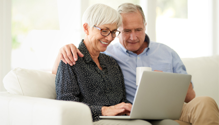 Two seniors reviewing insurance policies