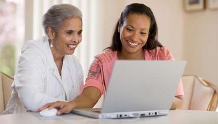 Two women reading information